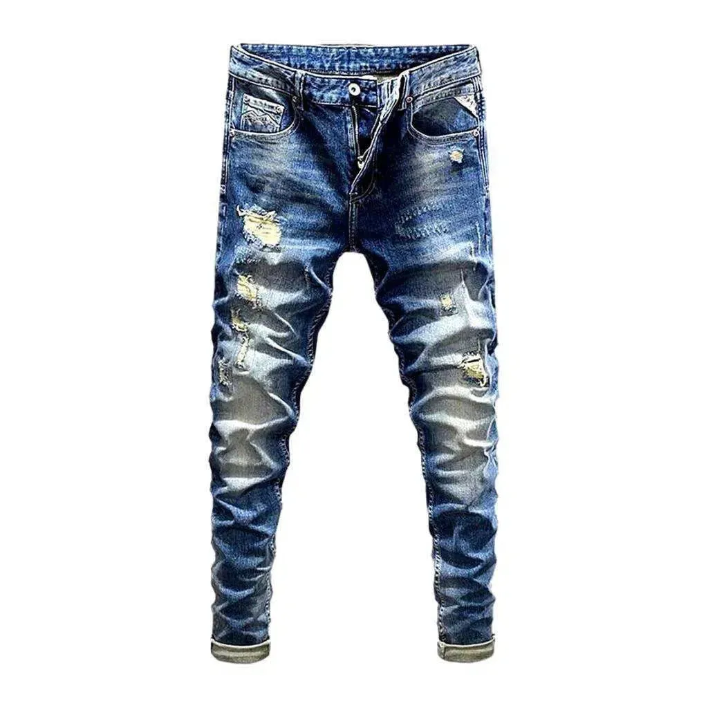 Distressed men's street jeans