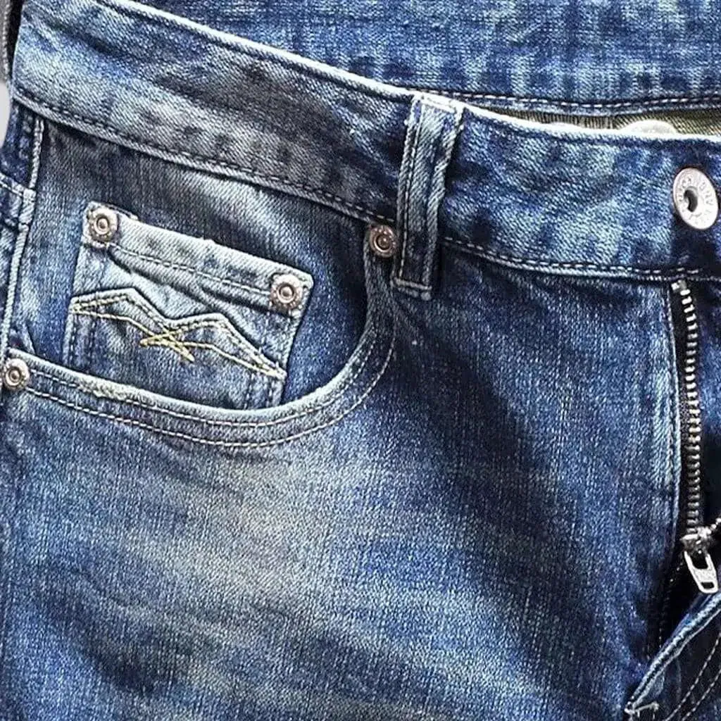 Distressed men's street jeans